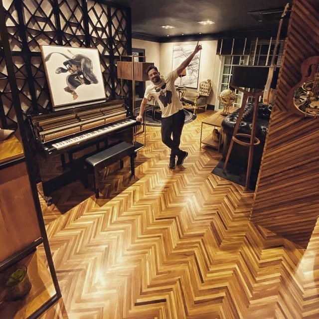 Dramatic room with herringbone wood floor